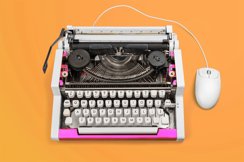 An orange background with white and pink typewriter. A modern, white computer mouse is connected at the side.
